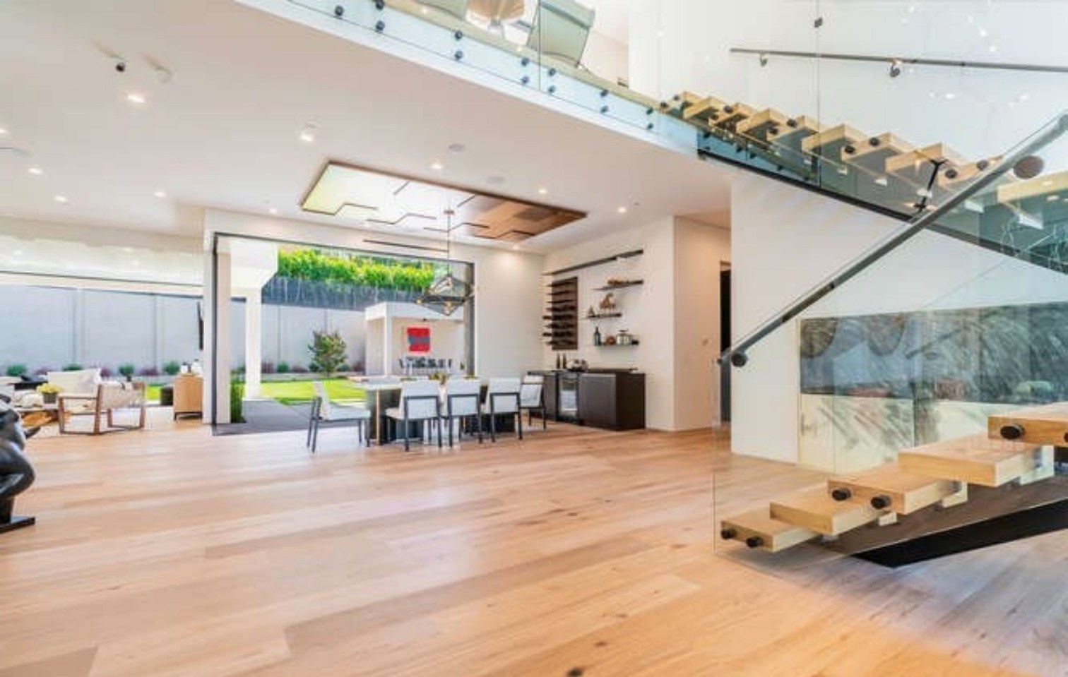 Great room with floating stair and glass guardrail