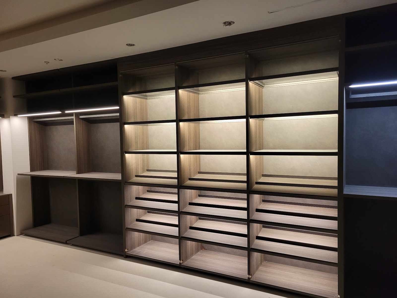 Walk-in closet with blackened metal shelving — Boca de Canon custom home build in Brentwood, Los Angeles