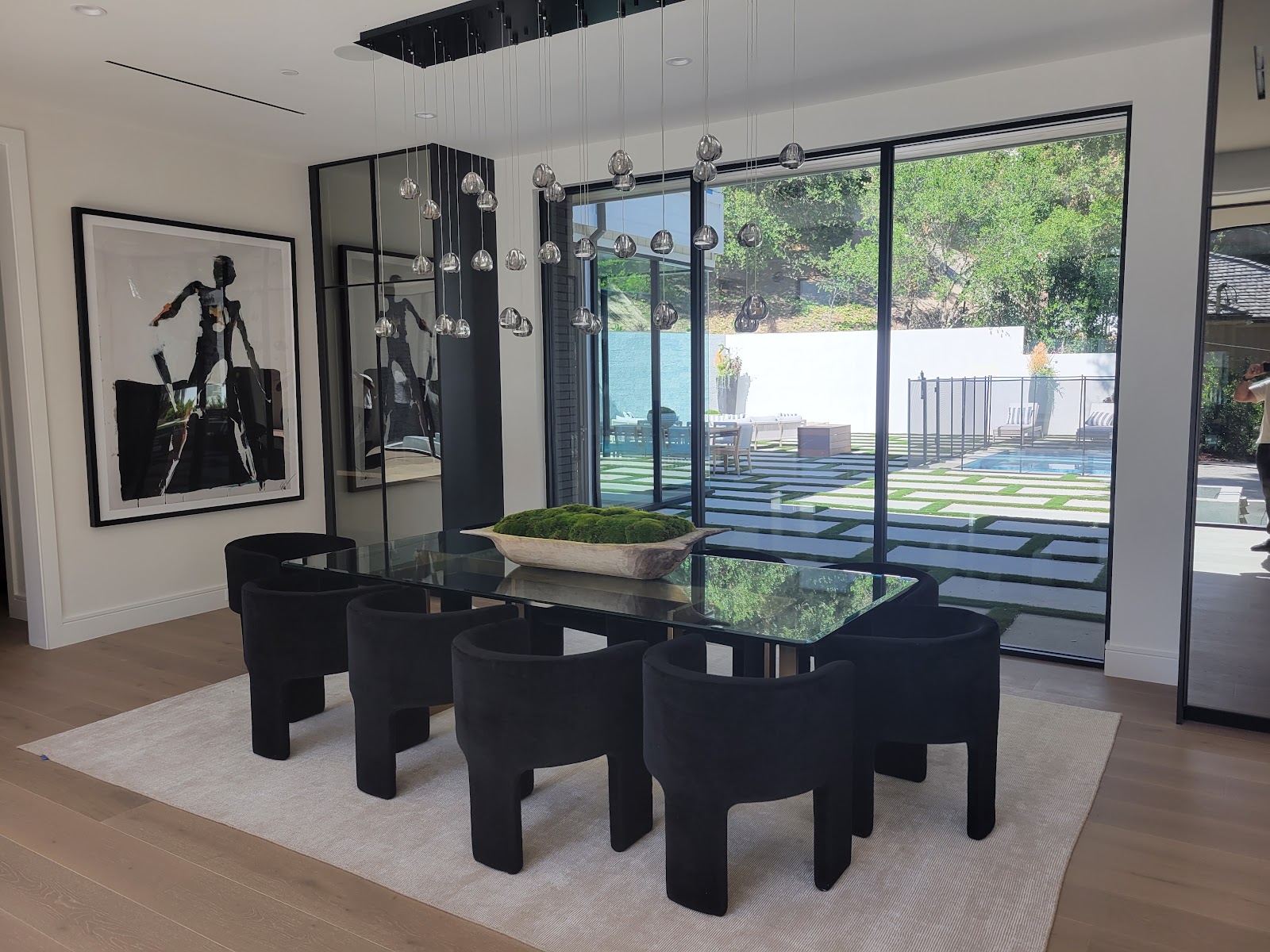 Dining room with custom lighting and art wall — Boca de Canon custom home build in Brentwood, Los Angeles