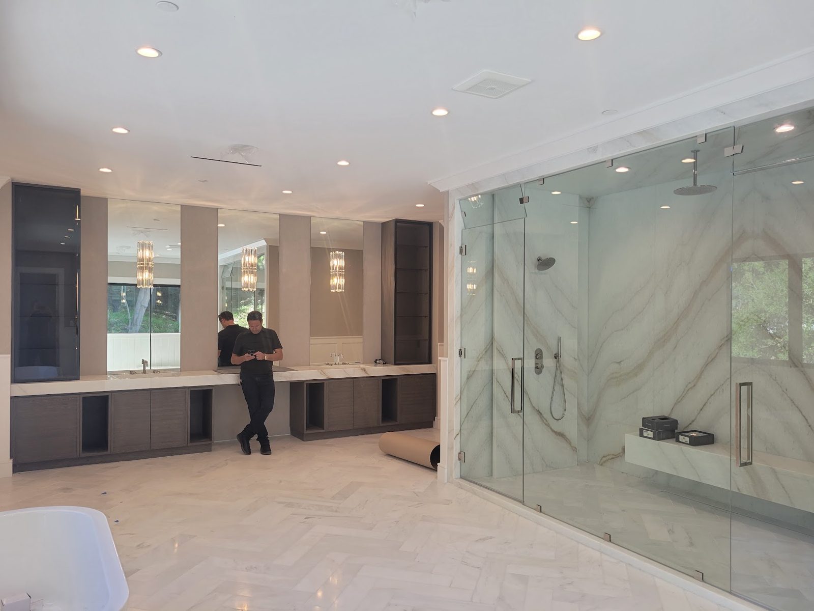 Book-matched marble bathroom wall — Boca de Canon custom home build in Brentwood, Los Angeles