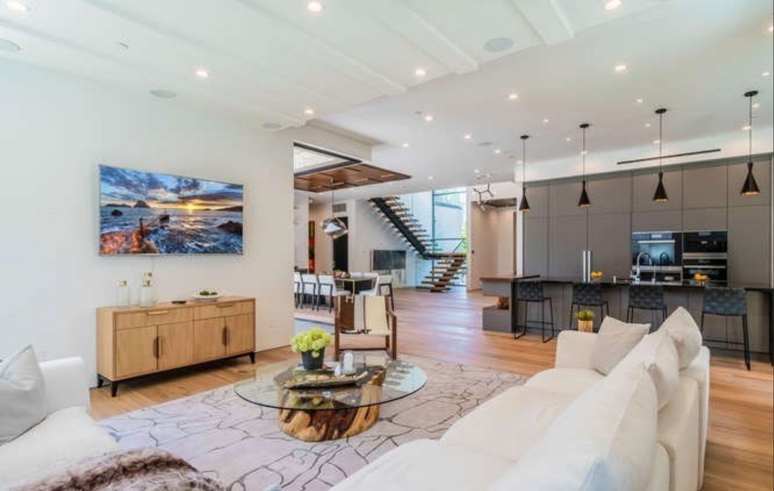 Furnished living room with oak floors
