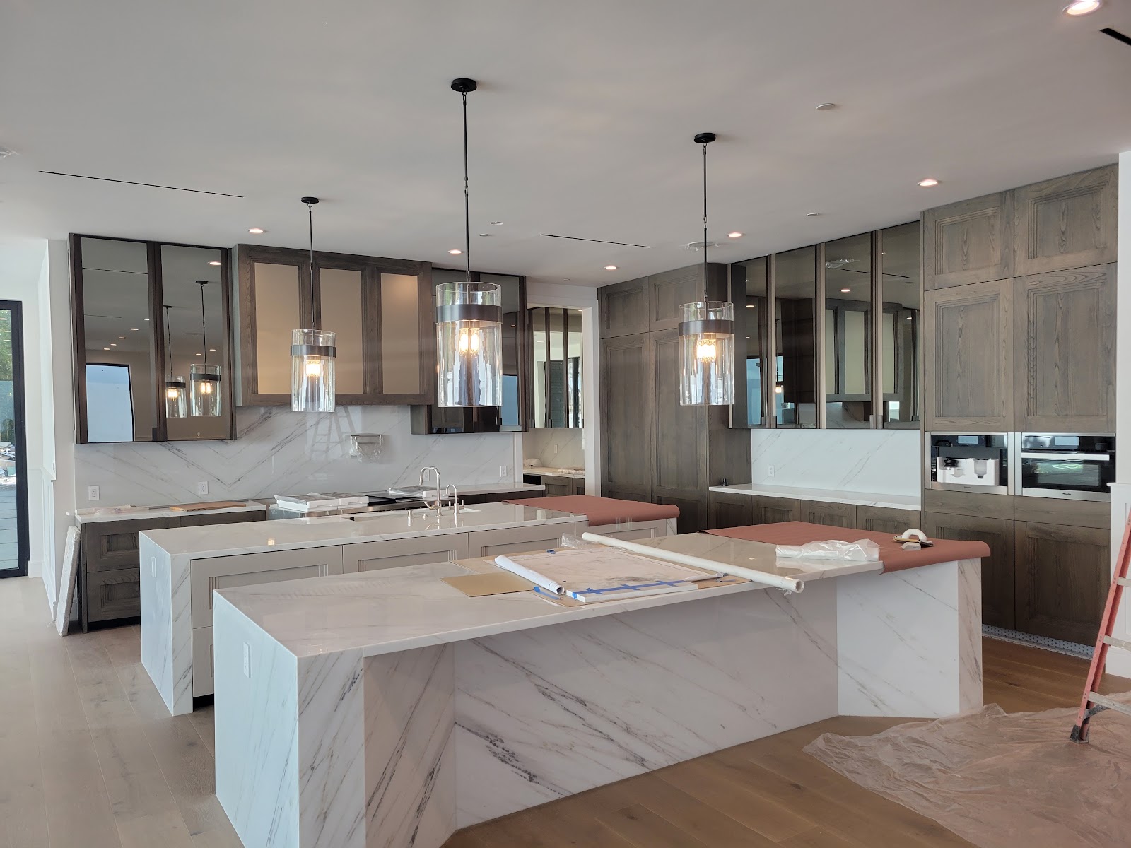 Twin stone islands in the main kitchen — Boca de Canon custom home build in Brentwood, Los Angeles