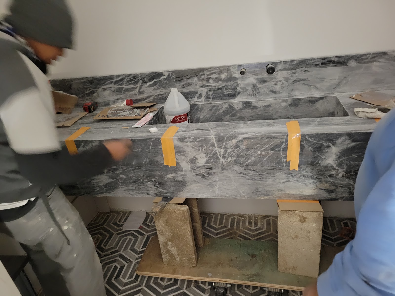Setting a marble slab on site — Boca de Canon custom home build in Brentwood, Los Angeles