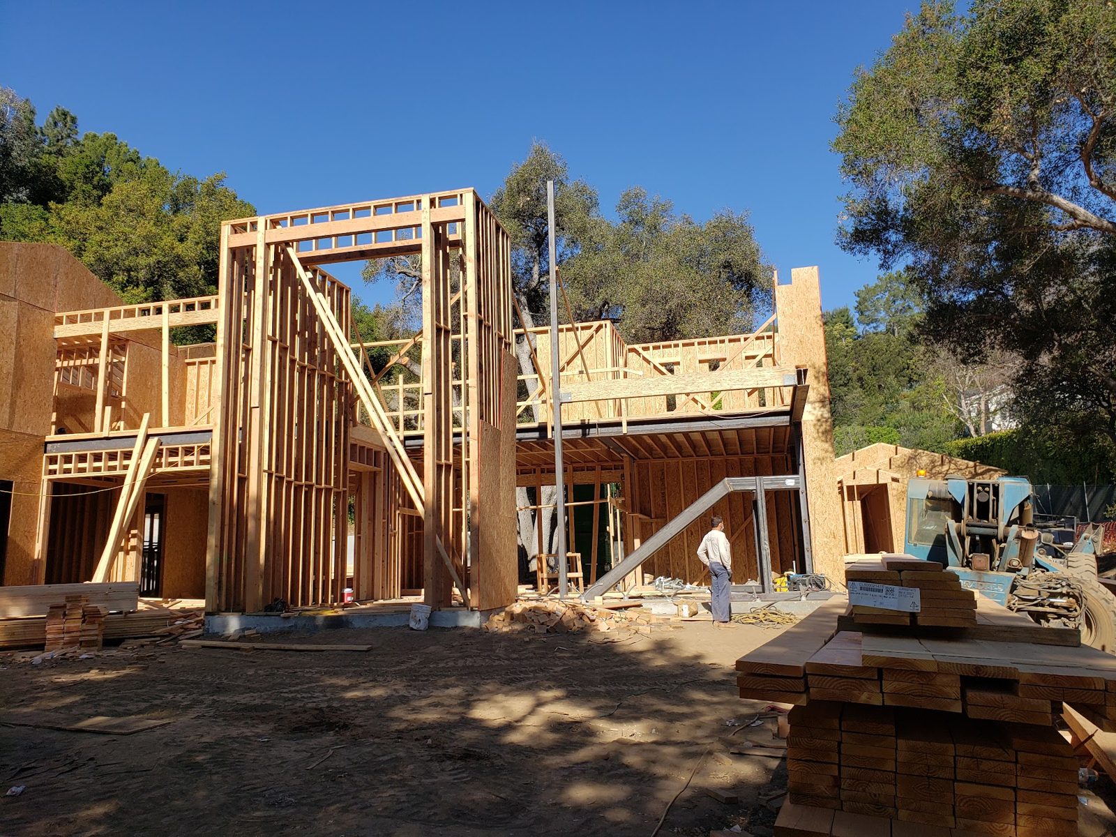 Framing crew working on the hillside build — Boca de Canon custom home build in Brentwood, Los Angeles