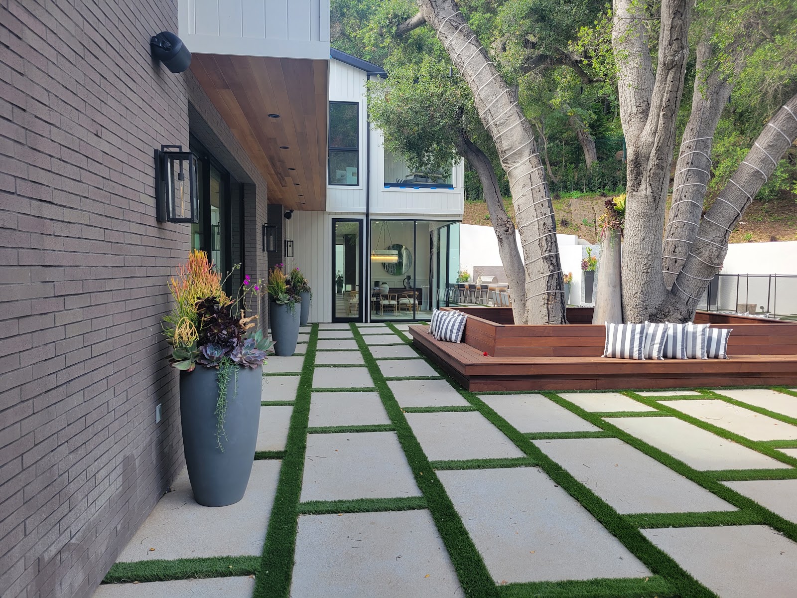 Entry courtyard paving and planted beds — Boca de Canon custom home build in Brentwood, Los Angeles