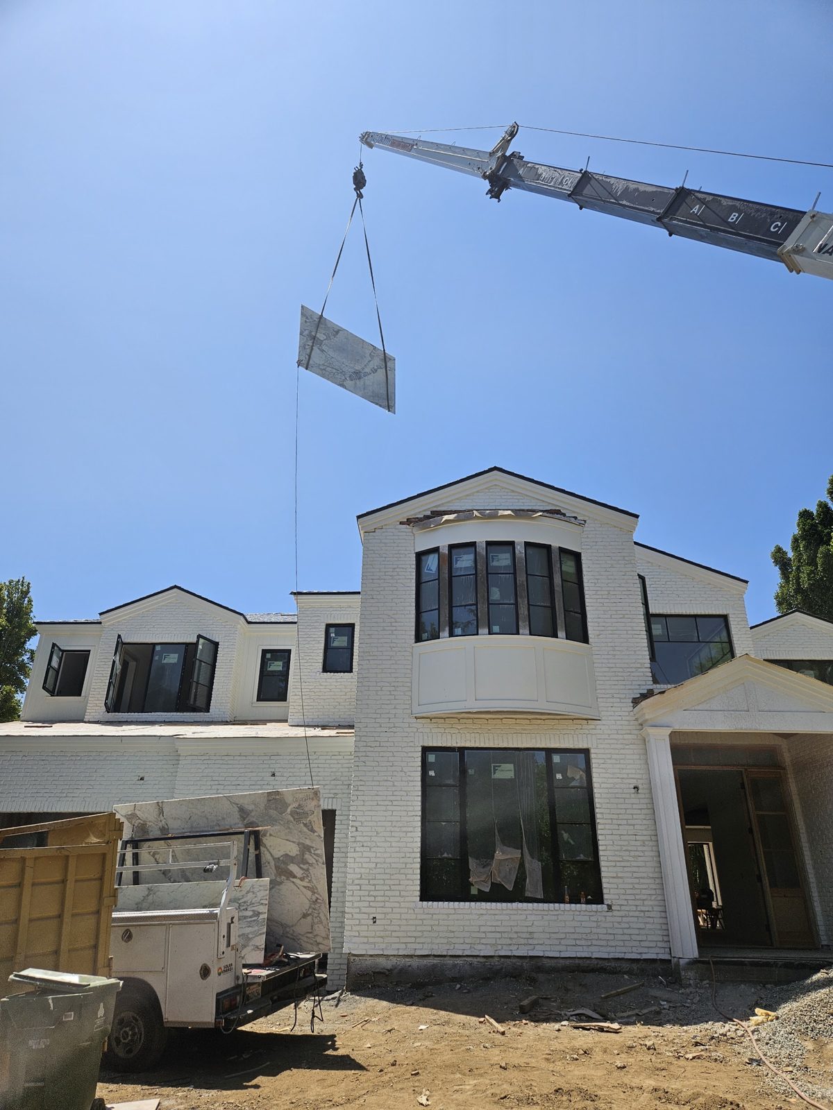 Exterior plaster and window work in progress
