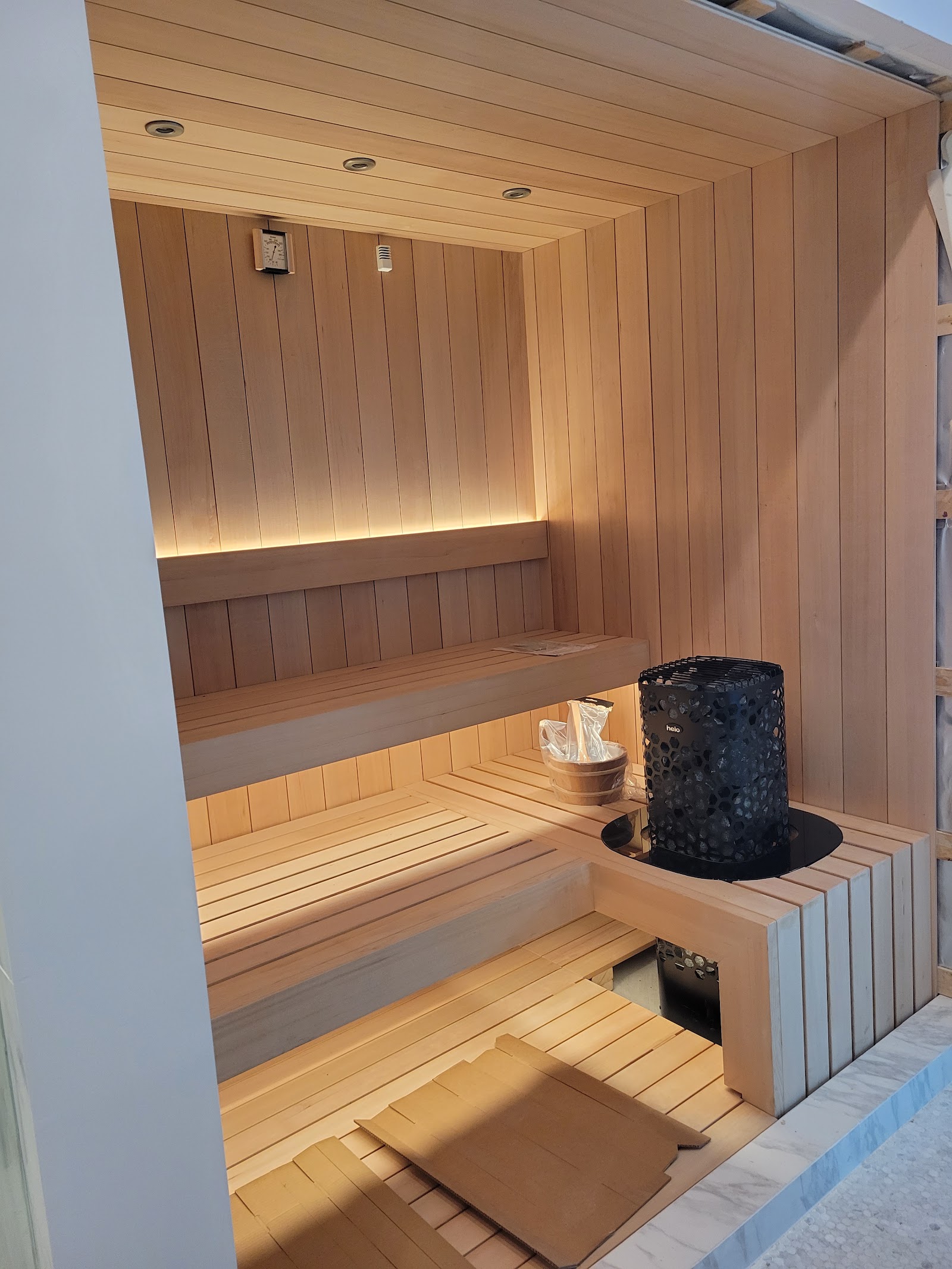 Cedar-lined sauna with tiered benches — Boca de Canon custom home build in Brentwood, Los Angeles