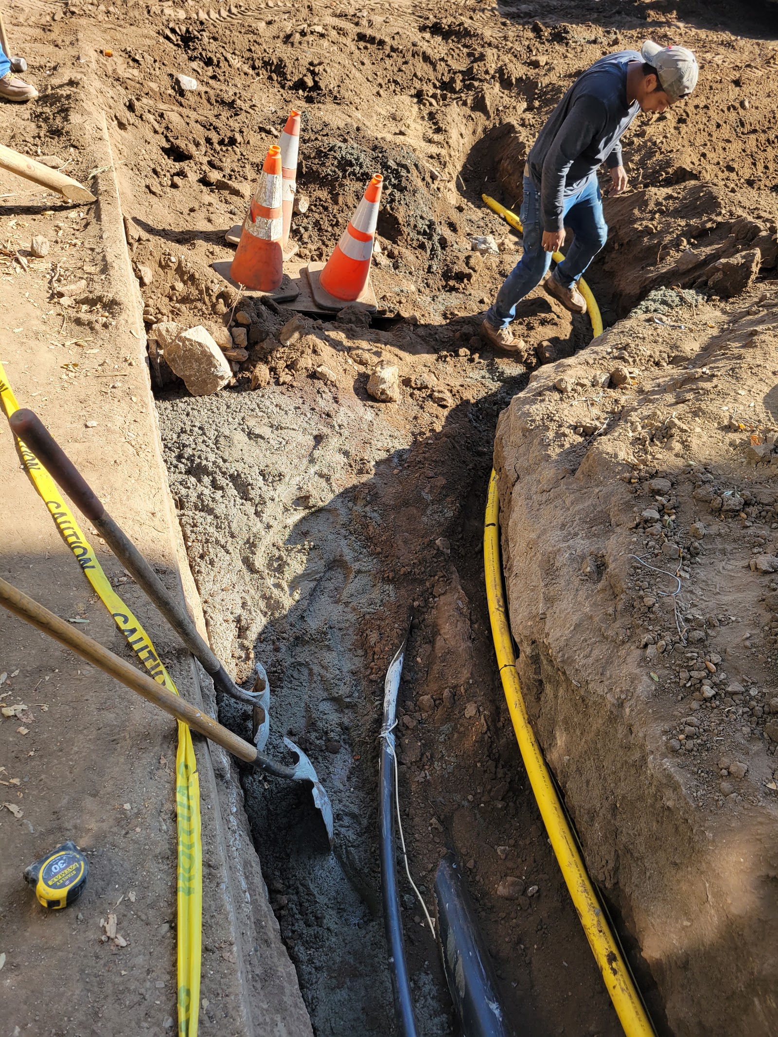 Utility trenching along the hillside driveway — Boca de Canon custom home build in Brentwood, Los Angeles