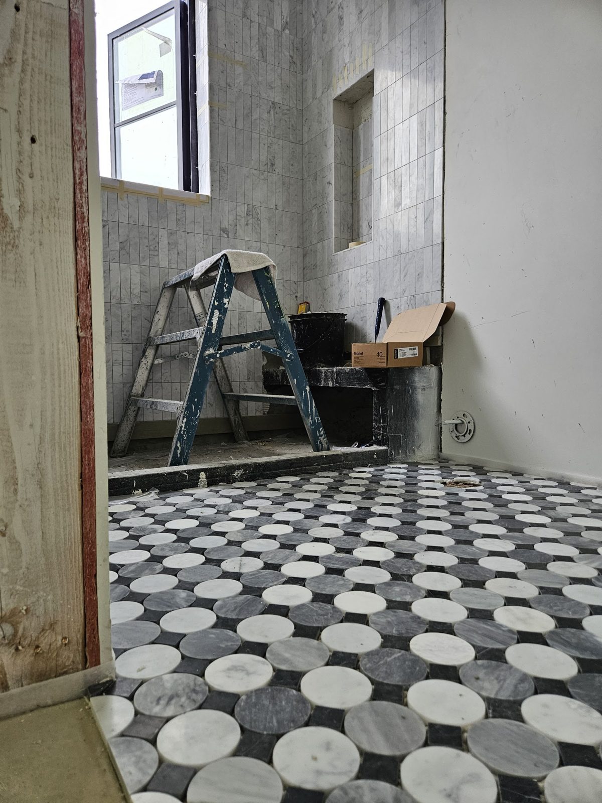 Checkerboard stone tile floor installation