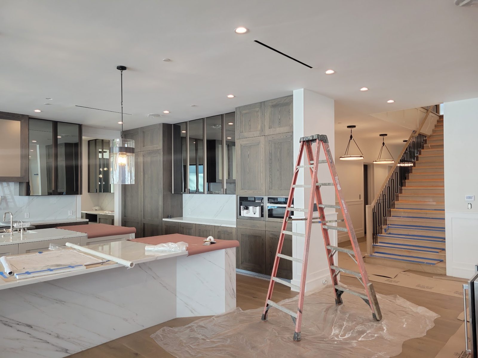 Waterfall stone island and custom cabinetry — Boca de Canon custom home build in Brentwood, Los Angeles